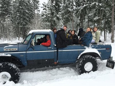 Truck full of kids having a great time.